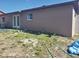 Rear view of the house, showcasing a back door and an open yard at 16 N Lancelot Ave, Orlando, FL 32835