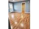 Spacious living room with wood-look flooring and neutral walls at 16 N Lancelot Ave, Orlando, FL 32835
