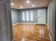 Bright living room with wood floors and neutral walls at 16 N Lancelot Ave, Orlando, FL 32835