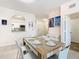 Bright dining room with modern furnishings, and view to the kitchen at 2809 Almaton Loop # 304, Kissimmee, FL 34747