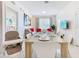 Bright dining room with modern furnishings, a large table, and an open floor plan to adjacent living space at 2809 Almaton Loop # 304, Kissimmee, FL 34747