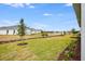 Landscaped backyard with pond view at 2944 Arranmore Dr, Ormond Beach, FL 32174