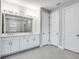 Double vanity bathroom with modern white cabinets at 2944 Arranmore Dr, Ormond Beach, FL 32174