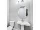 Small bathroom with pedestal sink and toilet at 2944 Arranmore Dr, Ormond Beach, FL 32174