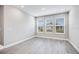 Spacious bedroom with three windows and neutral decor at 2944 Arranmore Dr, Ormond Beach, FL 32174