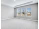 Spacious bedroom with three windows and neutral decor at 2944 Arranmore Dr, Ormond Beach, FL 32174