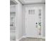 Front entry with white door and sidelights at 2944 Arranmore Dr, Ormond Beach, FL 32174
