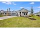 Two-story home with gray siding and stone accents at 2944 Arranmore Dr, Ormond Beach, FL 32174