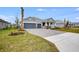 House exterior with gray garage door and paver driveway at 2944 Arranmore Dr, Ormond Beach, FL 32174