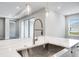Modern kitchen sink and faucet with a large island at 2944 Arranmore Dr, Ormond Beach, FL 32174