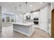 Modern kitchen with white cabinets and island at 2944 Arranmore Dr, Ormond Beach, FL 32174