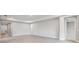 Spacious living room with light gray walls and wood-look floors at 2944 Arranmore Dr, Ormond Beach, FL 32174