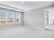 Bright and airy main bedroom with plush carpeting at 2944 Arranmore Dr, Ormond Beach, FL 32174