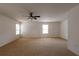 Primary bedroom with ceiling fan and carpet at 1513 Blue Sky Way, Clermont, FL 34714