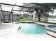 Relaxing screened pool and spa overlooking lake at 1513 Blue Sky Way, Clermont, FL 34714