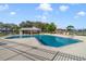 Community pool with spacious deck, lounge chairs, and shade pavilion at 2686 Maxwell W Ct, Kissimmee, FL 34743