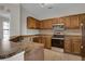 Spacious kitchen boasts stainless steel appliances and ample counter space at 6107 Metrowest Blvd # 104, Orlando, FL 32835