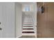 Bright staircase featuring white risers and wood treads at 6107 Metrowest Blvd # 104, Orlando, FL 32835