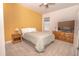 Comfortable bedroom with a warm color scheme, a large TV, and a spacious layout for relaxation at 1511 Alligator St, St Cloud, FL 34771