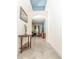 Hallway leading to the living room, featuring arched doorways and modern decor at 1511 Alligator St, St Cloud, FL 34771