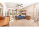 Spacious main bedroom featuring a four-poster bed, neutral décor, and large windows for ample natural light at 1511 Alligator St, St Cloud, FL 34771