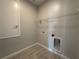 Utility Room with tile flooring, wire shelving, and access points for laundry equipment at 5286 Teirgarten St, Saint Cloud, FL 34771