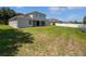 Spacious backyard featuring a well-maintained lawn and white fence, perfect for outdoor activities at 1147 Degraw Dr, Apopka, FL 32712