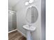 Bathroom featuring a pedestal sink, a modern framed mirror, and an enclosed shower at 1147 Degraw Dr, Apopka, FL 32712