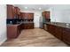 Spacious kitchen featuring stainless steel appliances, wood cabinets and tile floor at 1147 Degraw Dr, Apopka, FL 32712
