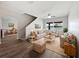 Bright living room featuring neutral-toned furniture, hardwood floors, and plenty of natural light at 1147 Degraw Dr, Apopka, FL 32712