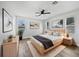 Relaxing main bedroom with stylish decor, ceiling fan, and large windows for natural light at 1147 Degraw Dr, Apopka, FL 32712