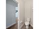Powder room featuring a toilet, and tile floors and access to stairs at 1147 Degraw Dr, Apopka, FL 32712