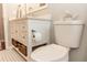 Elegant bathroom showcasing a vanity with under-storage baskets, toilet, and stylish decor at 19808 Seaview St, Orlando, FL 32833