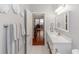 Modern bathroom with white vanity and view of dining area at 19808 Seaview St, Orlando, FL 32833