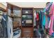 Organized walk-in closet with custom shelving, drawers, rods, and plenty of storage for clothes at 19808 Seaview St, Orlando, FL 32833