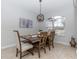 Dining area with wooden table and chairs near a large window at 19808 Seaview St, Orlando, FL 32833