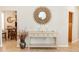 Elegant entryway with a console table and sunburst mirror at 19808 Seaview St, Orlando, FL 32833