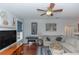 Relaxing living room, featuring hardwood floors, sectional sofa, and large windows at 19808 Seaview St, Orlando, FL 32833