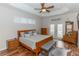 Main bedroom with wood floors, king bed and access to backyard at 19808 Seaview St, Orlando, FL 32833