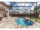 Enclosed pool area with patio and hot tub at 19808 Seaview St, Orlando, FL 32833