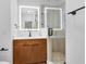 Modern bathroom with an illuminated mirror, stylish vanity, and a sleek glass-enclosed shower at 4024 W Danby Ct, Winter Springs, FL 32708
