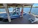 Modern boat under a covered dock, ready for watersports and lake adventures at 4024 W Danby Ct, Winter Springs, FL 32708