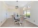 Bright dining room with light wood flooring, modern light fixture, and a large window at 4024 W Danby Ct, Winter Springs, FL 32708