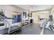 Home gym featuring cardio and strength equipment with a large window overlooking the pool area at 4024 W Danby Ct, Winter Springs, FL 32708