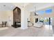 Spacious living room with a modern fireplace, high ceilings and views of the pool and lake at 4024 W Danby Ct, Winter Springs, FL 32708