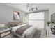 Comfortable main bedroom featuring a large bed, stylish barn door, and ample natural light for a serene retreat at 4024 W Danby Ct, Winter Springs, FL 32708