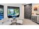 Cozy sitting area with wine storage and a view of the pool and lake at 4024 W Danby Ct, Winter Springs, FL 32708