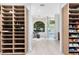 Spacious walk-in closet with custom built-in shelves, storage, and bench at 4024 W Danby Ct, Winter Springs, FL 32708