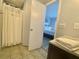 Bathroom with a shower and view to the bedroom at 6165 Carrier Dr # 2602, Orlando, FL 32819