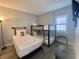 bedroom with bunk beds, a twin bed and modern wall art at 6165 Carrier Dr # 2602, Orlando, FL 32819